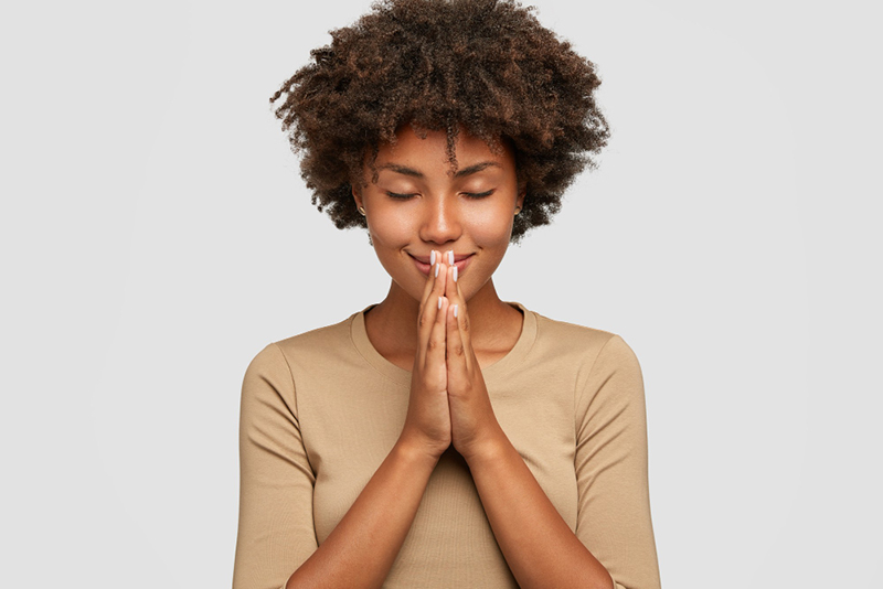 Woman meditating to reduce stress